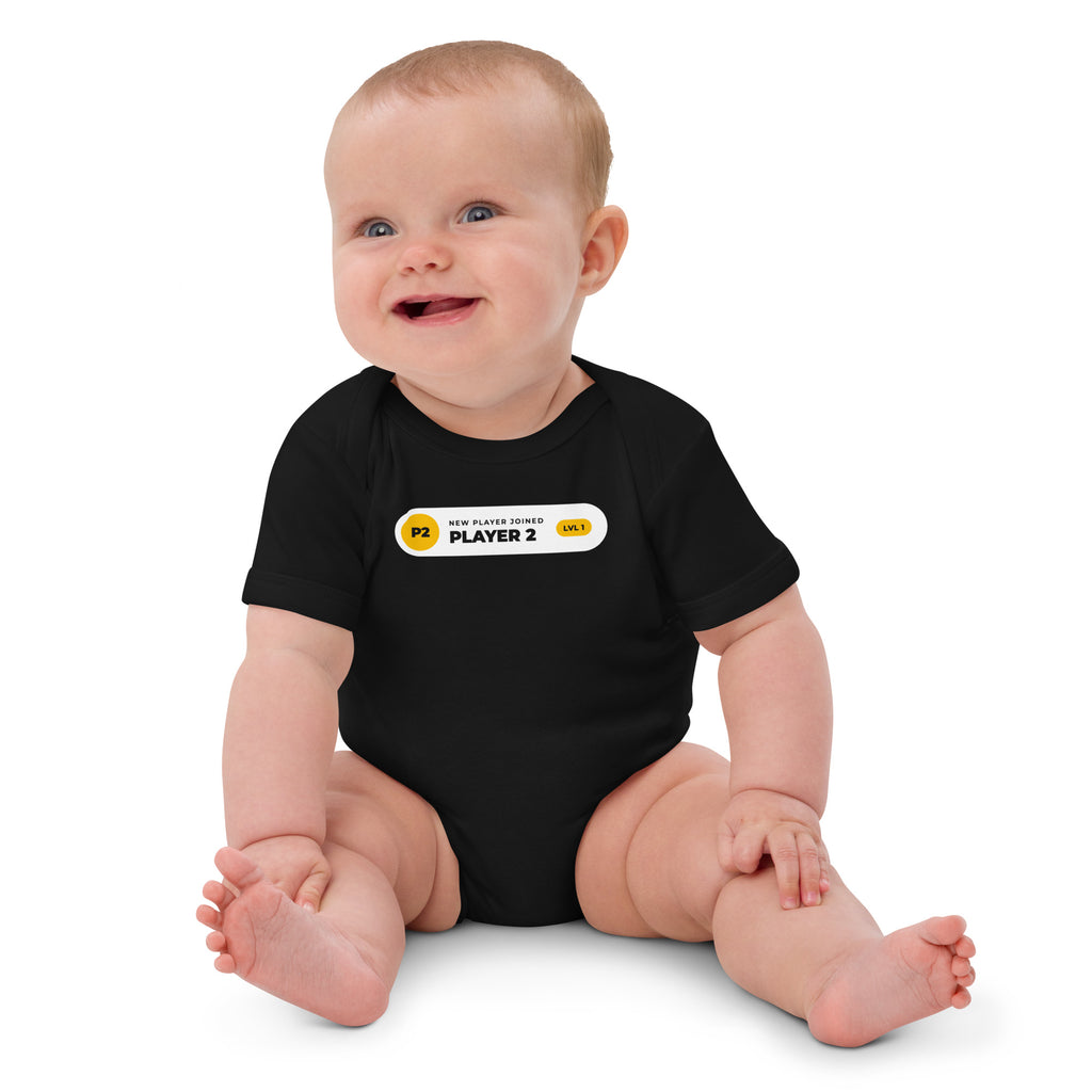 Player 2 Has Joined black baby bodysuit, white notification pill with gold P2 badge and LVL 1 (view 2)