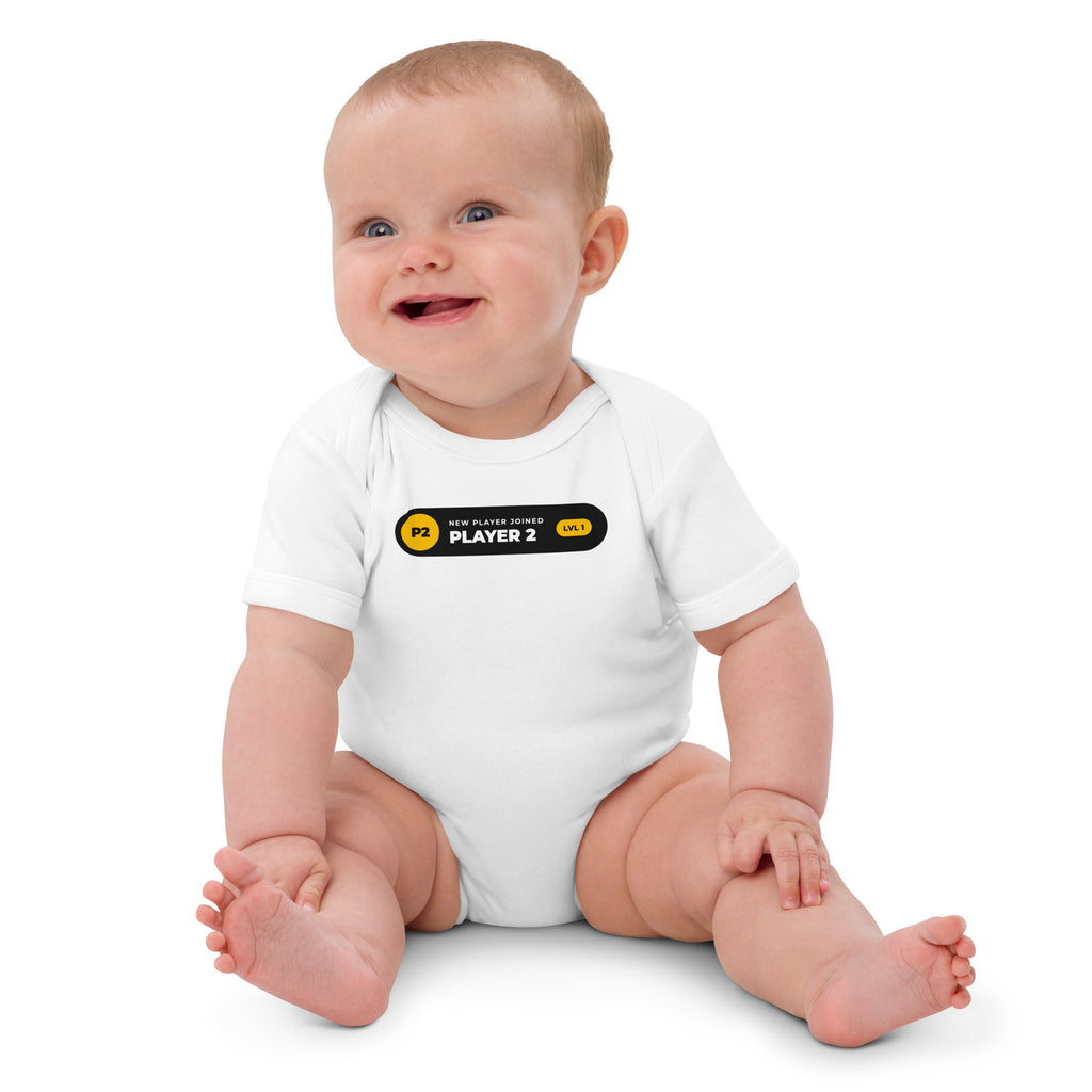 Player 2 Has Joined white baby bodysuit, black notification pill with gold P2 badge and LVL 1 (view 2)