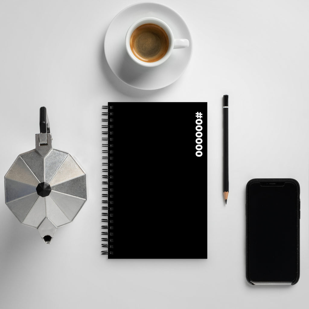 #000000 Hex Code black spiral notebook on a desk beside a coffee, moka pot, pencil and phone